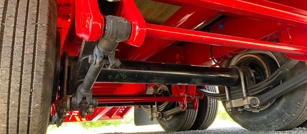 An underside view of a trailer showing a Hutch Heavy Duty Suspension