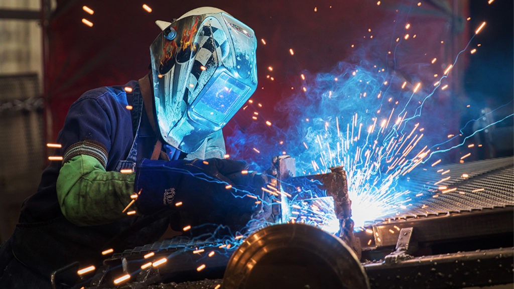 Welder working on a trailer