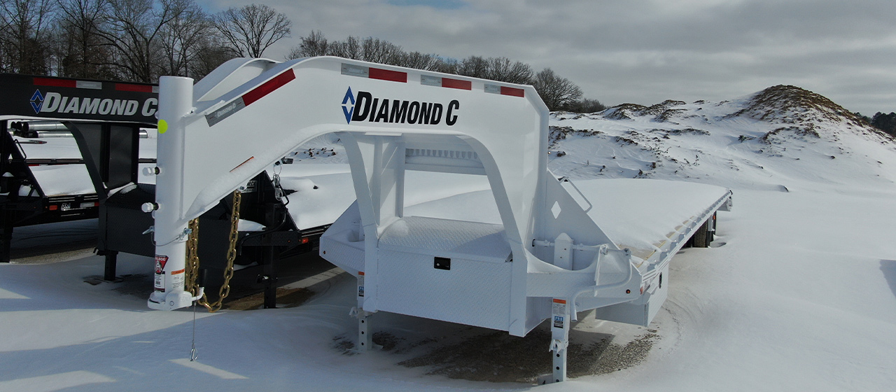 Diamond C's White Fleetneck Trailer in the Winter Covered in Snow