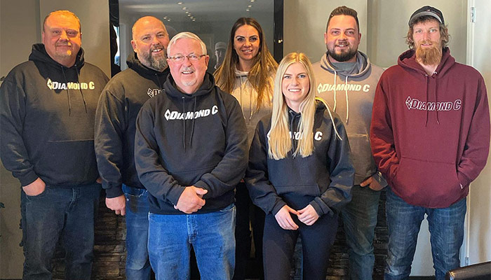 AutoQuest Auto & Trailer Sales staff in Diamond C merch