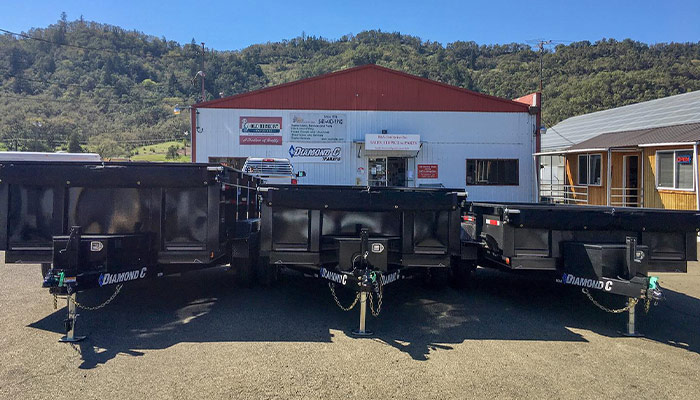 Diamond C dump trailers in front of B&V Enterprises.