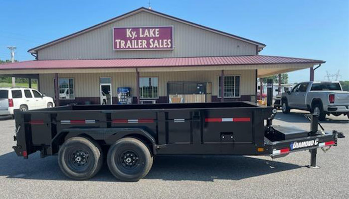 A Diamond C dump trailer in front of KY Lake Trailer Sales.