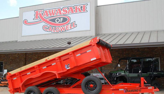 A Diamond C dump trailer in front of Kawasaki of Caldwell.