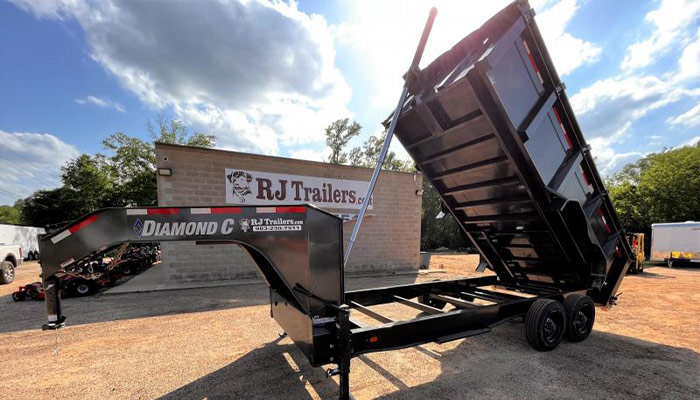 R&J Trailers, INC. Longview with a Diamond C trailer in front of the building.