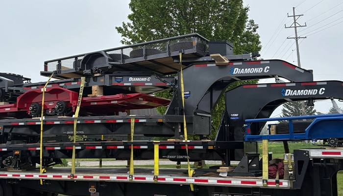 Holland Trailer with a Diamond C trailer load.