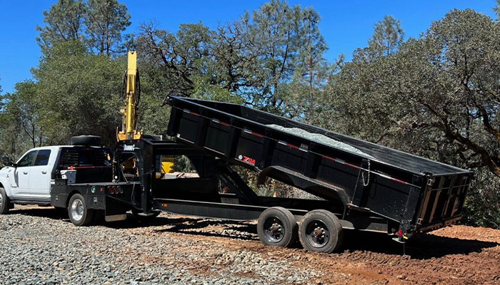 V-belt and Son and their favorite Diamond C dump trailer.