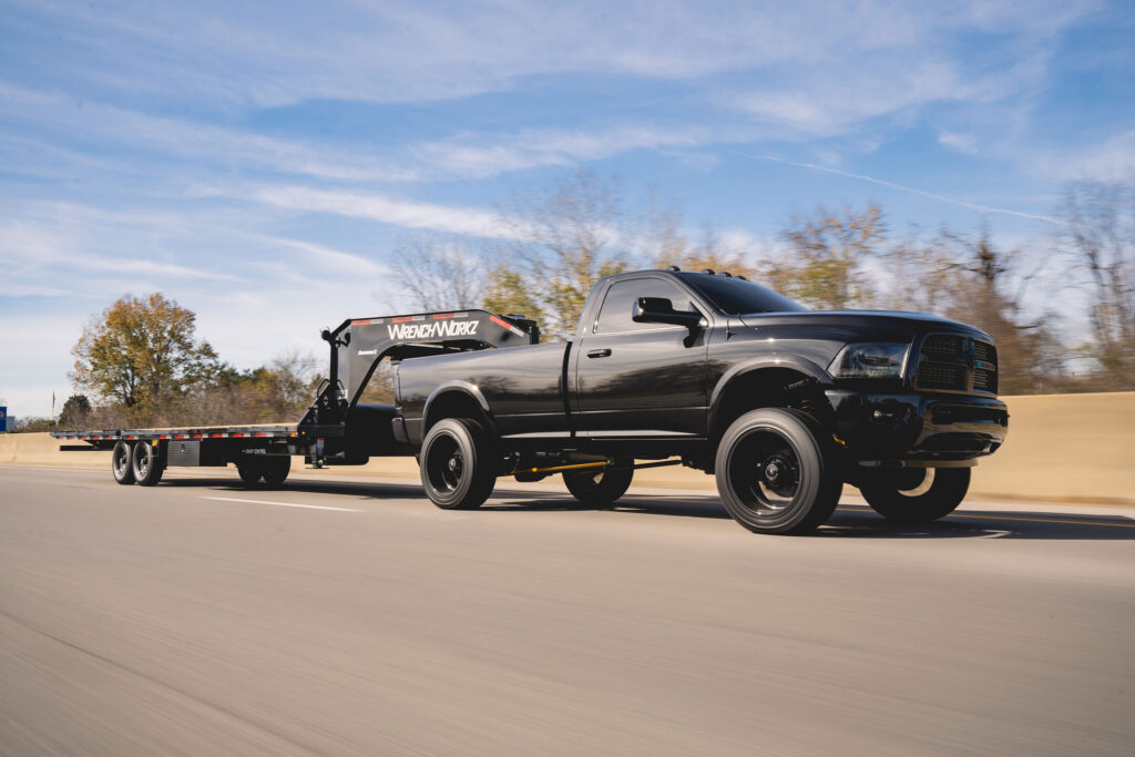 Greg Alberalla driving down the highway with a Diamond C trailer