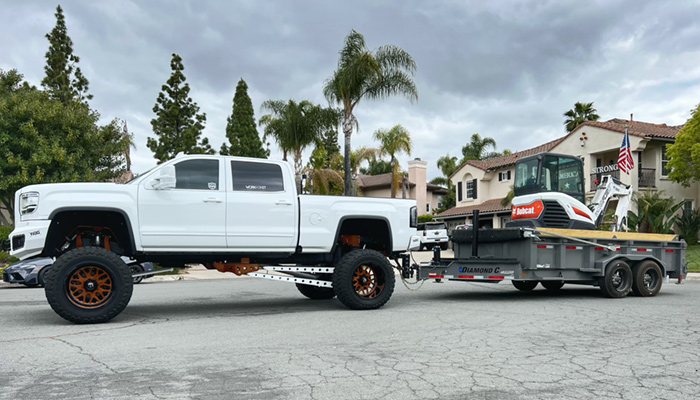 WORKFORIT Apparel's Ryan Fusco and his preferred Diamond C trailer of choice.